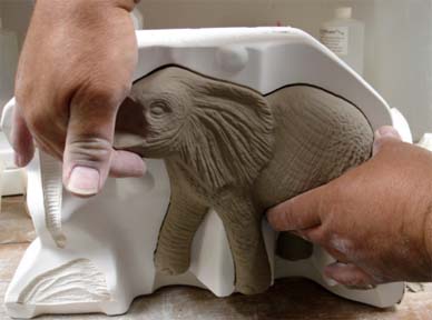 Removing elephant piece from the mold